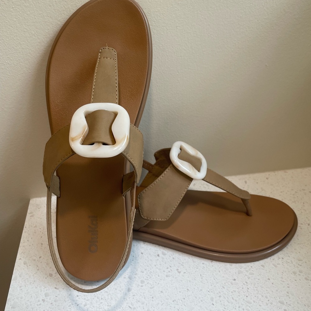 OluKai Tan and White Sandals with Decorative Buckle